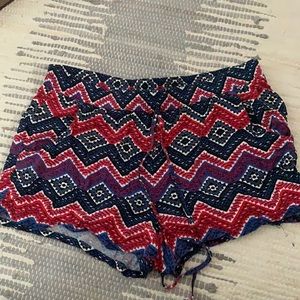 Red, black, blue and white flowy print shorts
